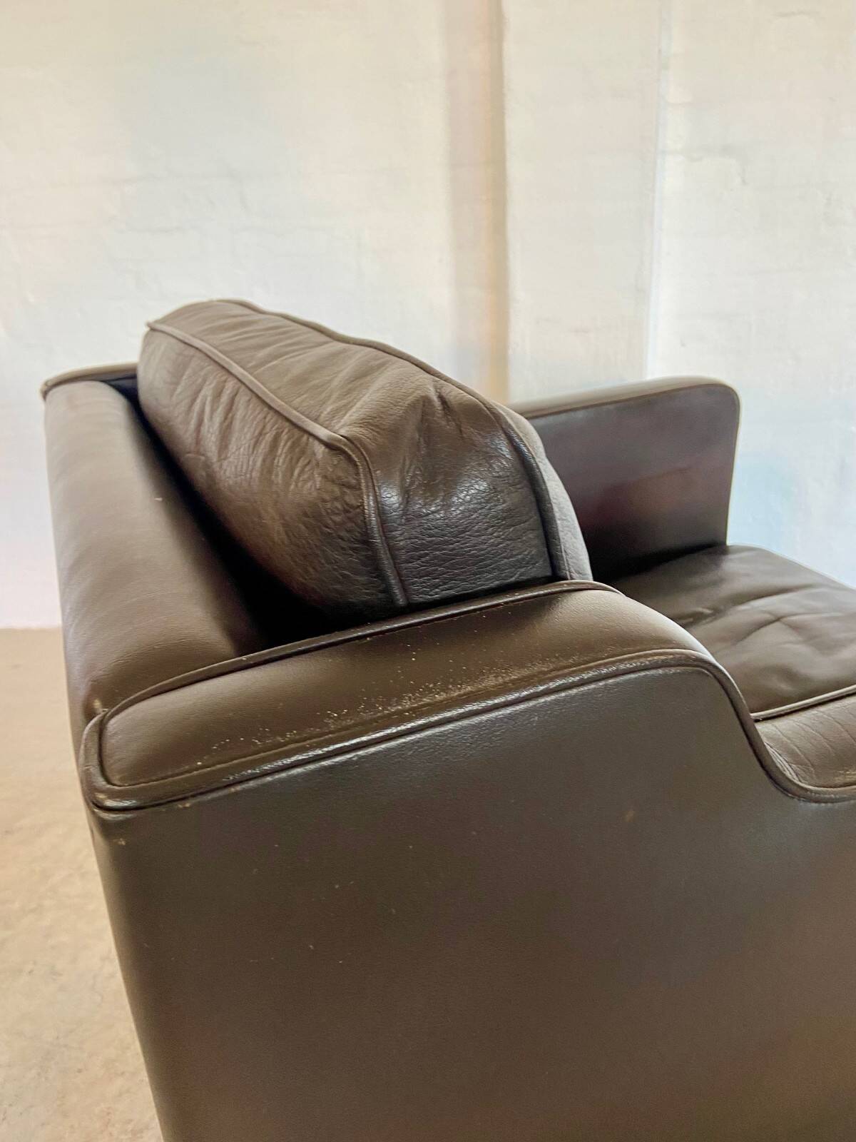Mid-century Stouby leather lounge chair and stool in brown leather