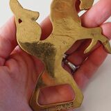 Animal bottle opener in gilded bronze