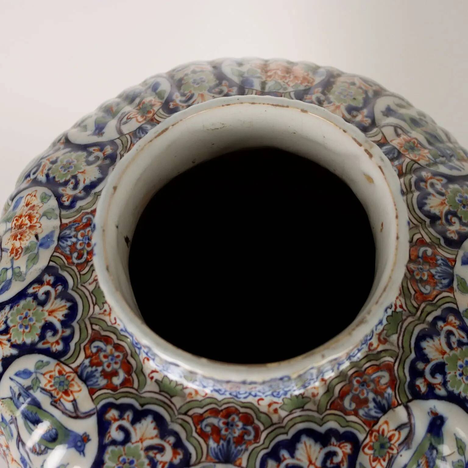 Ancient vase fully decorated with ceramic plants, 20th century.