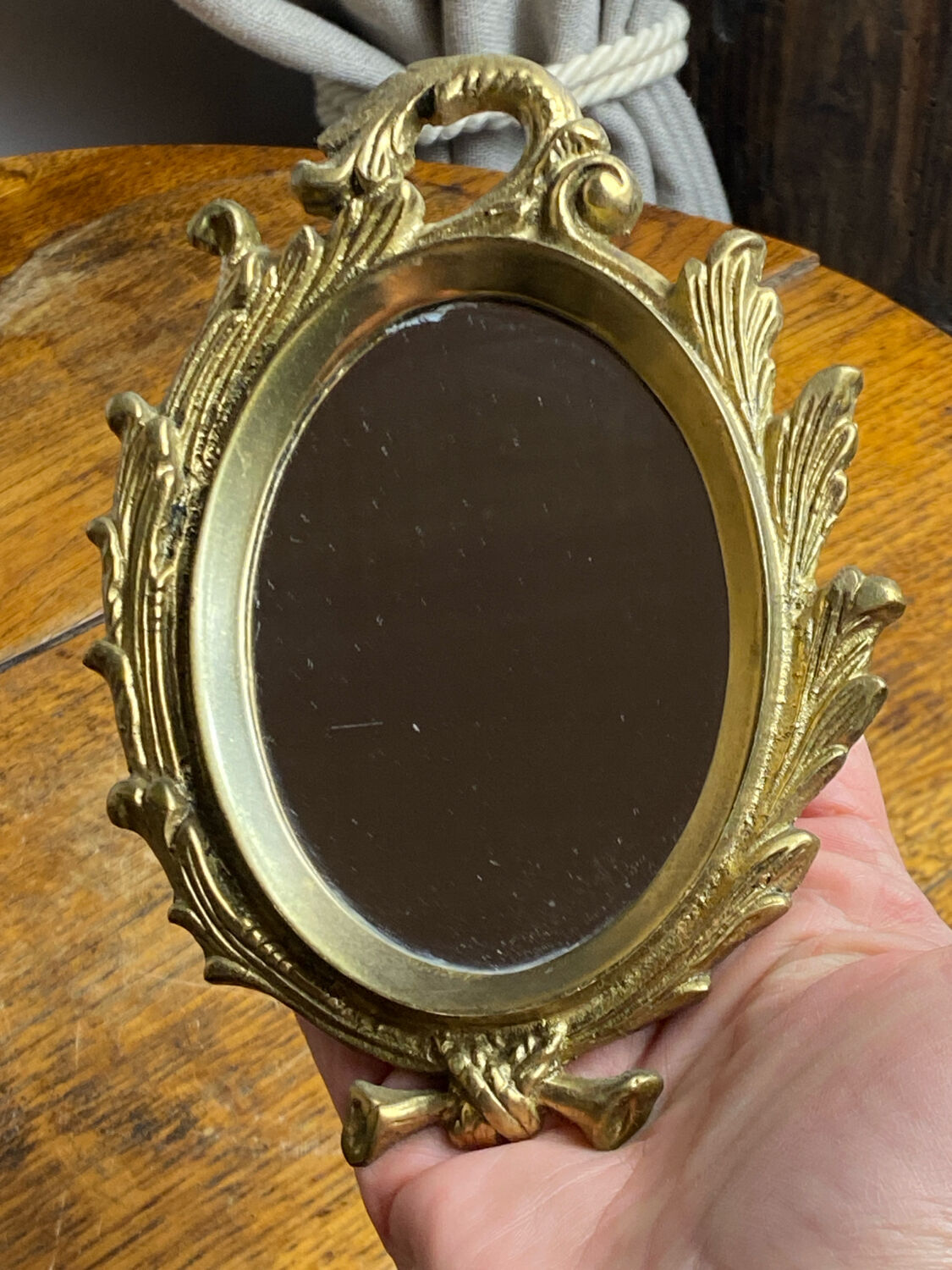 Small antique bronze mirror