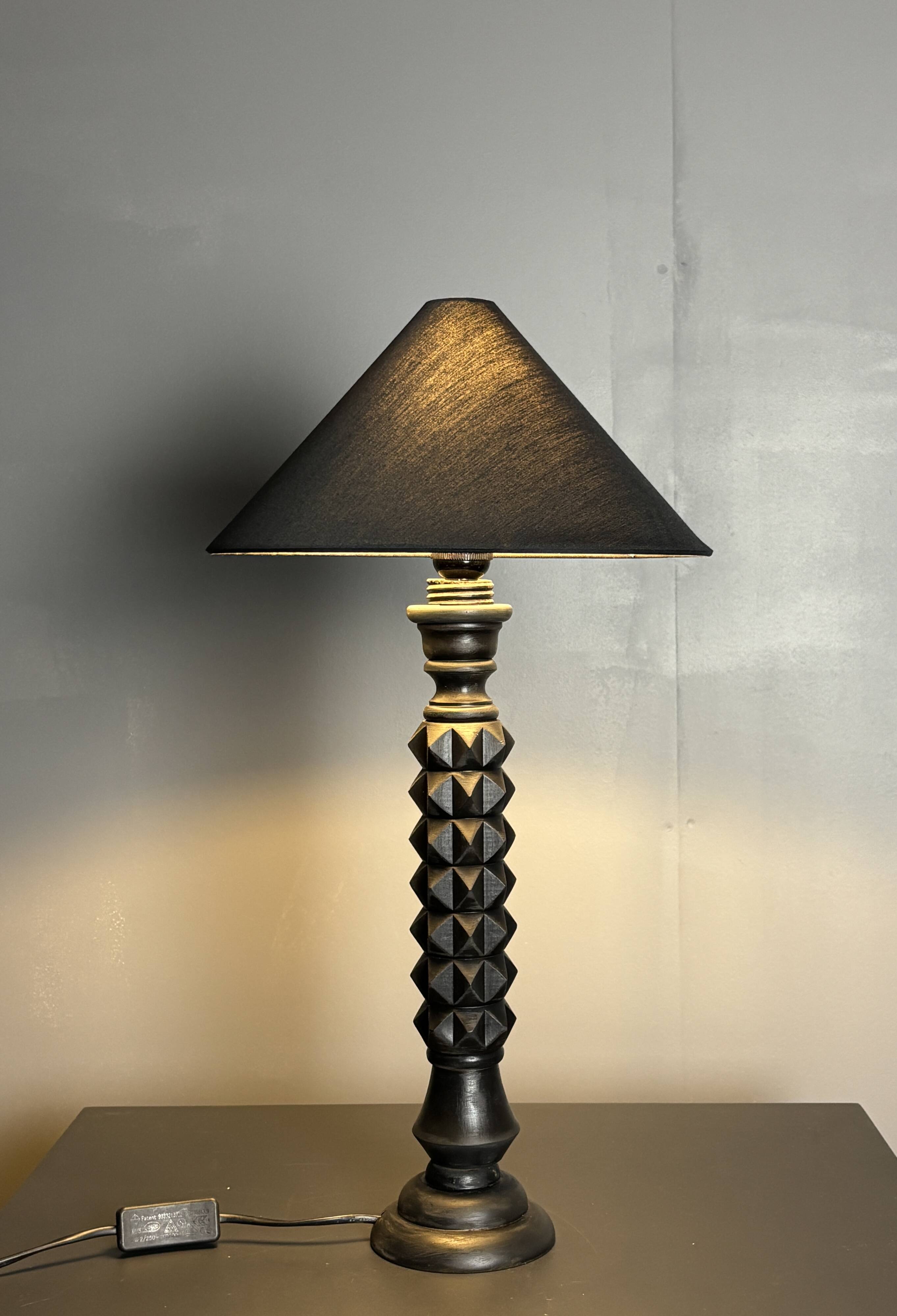Brutalist wood turned ebonized table lamp in the style of Charles Dudouyt