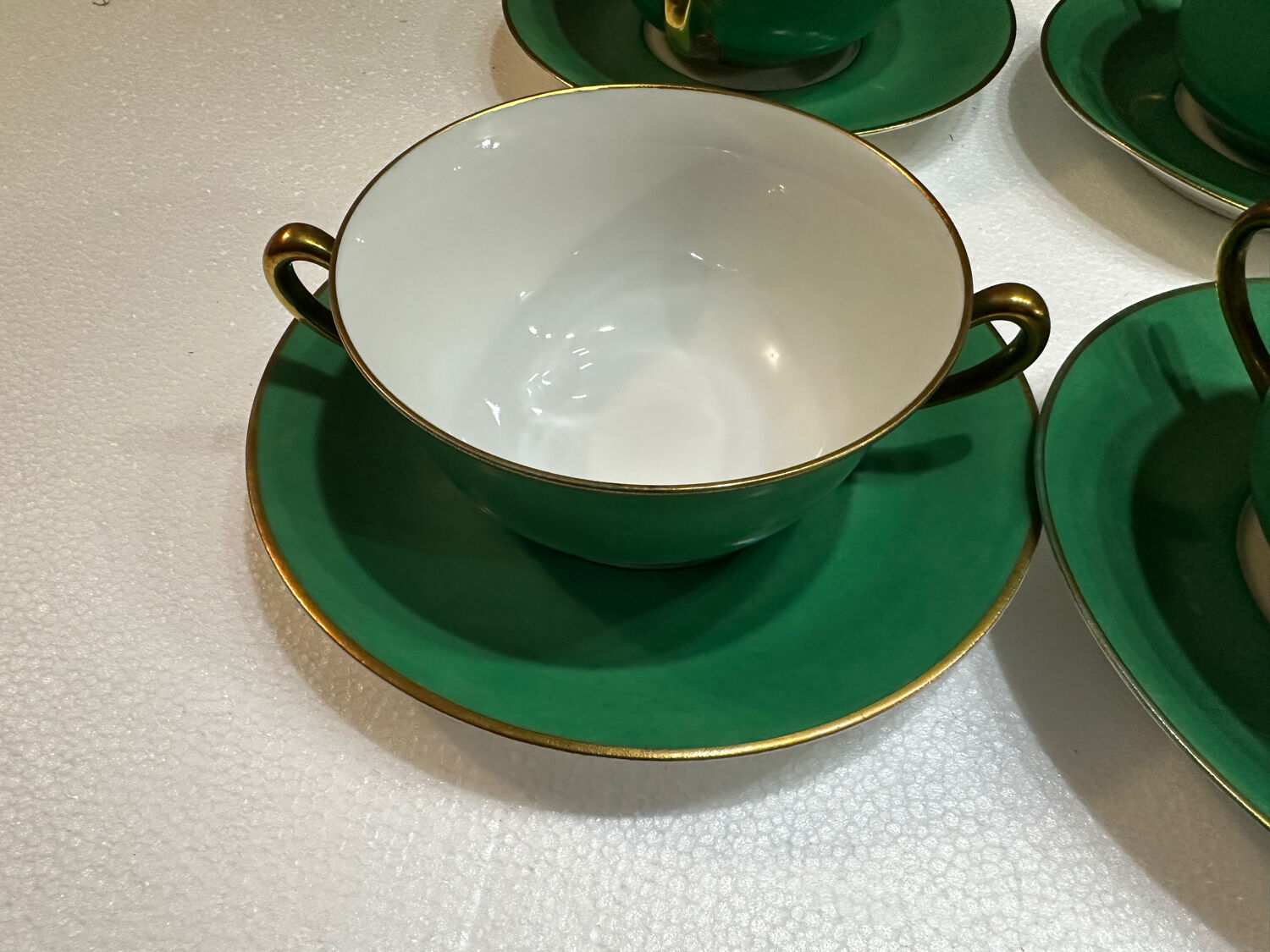 Service 14 cup and saucer in Art Deco Emerald Green and Gold.