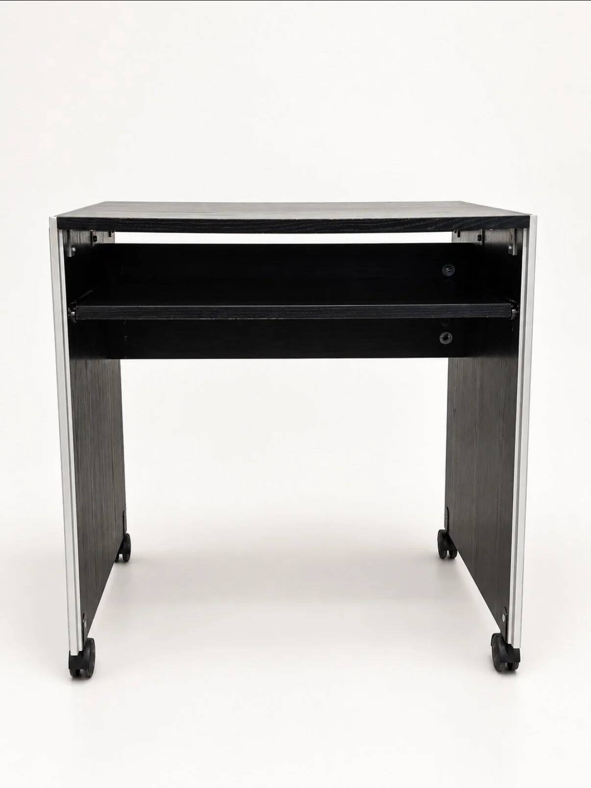 Vintage black computer desk on wheels with an aluminium edge.