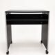 Vintage black computer desk on wheels with an aluminium edge.