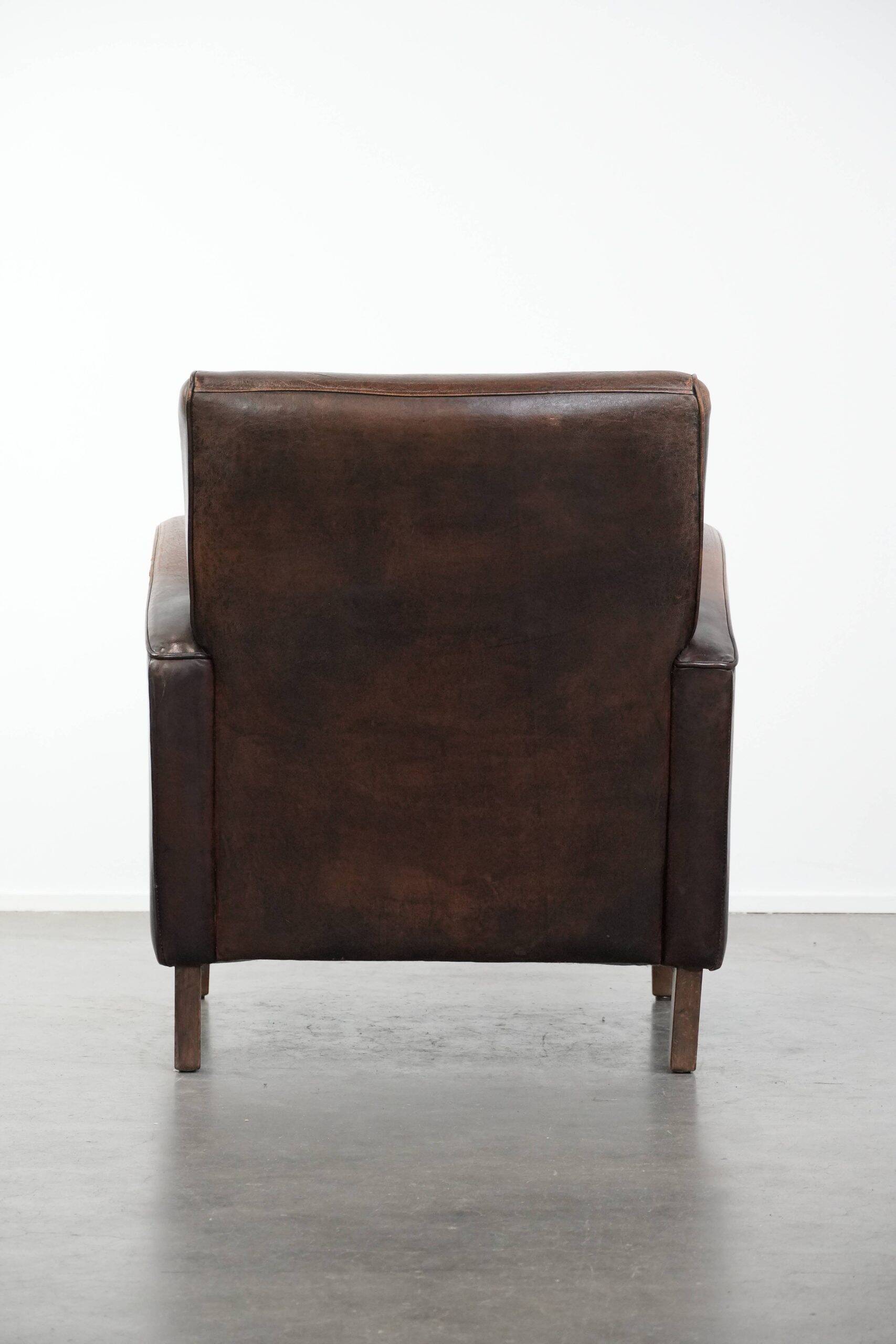 Vintage sheepskin leather design armchair in a dark cognac colour