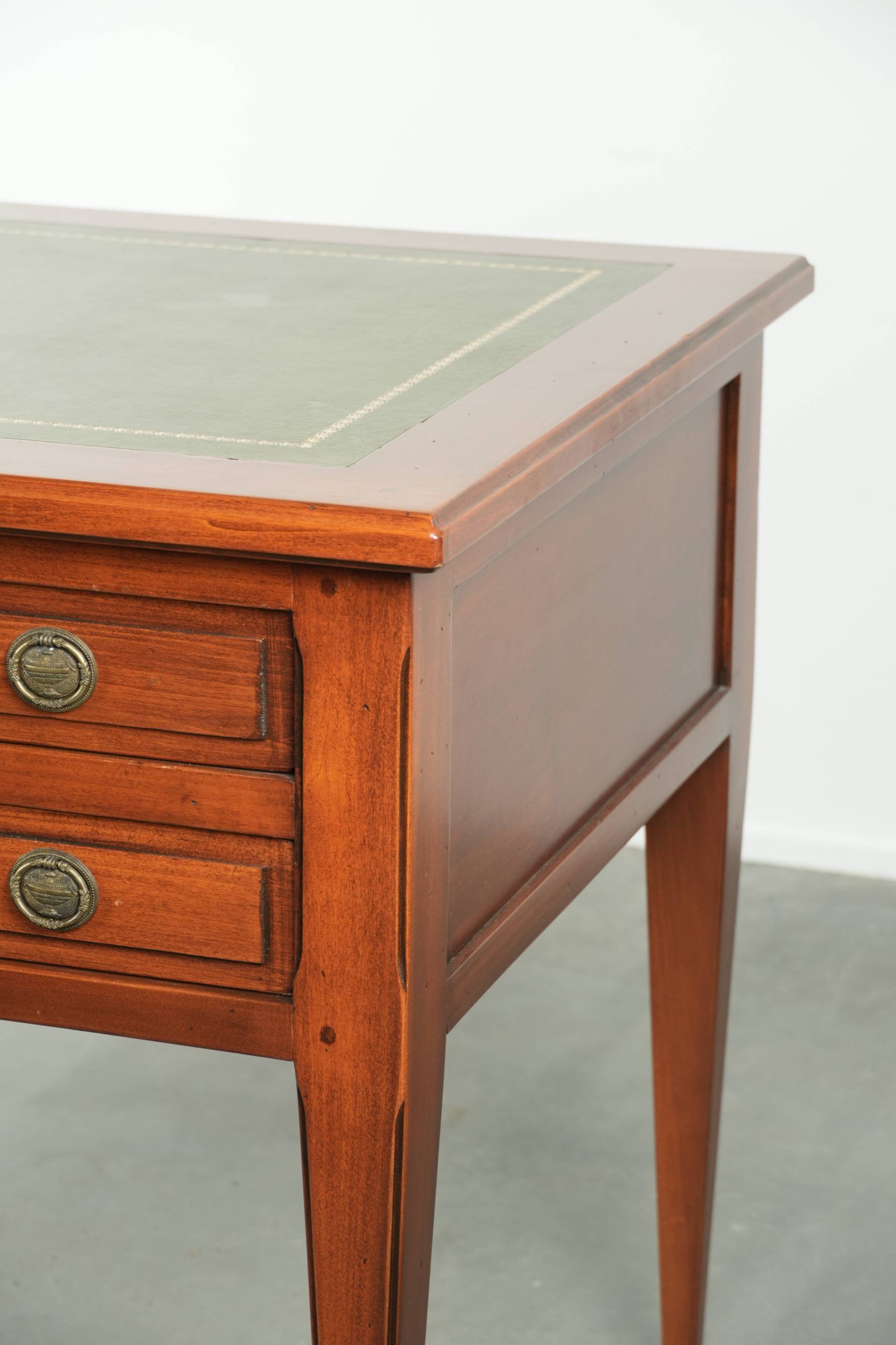 Elegant English style desk with green leather top, gold details and drawers