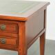 Elegant English style desk with green leather top, gold details and drawers