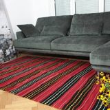 Hand-woven red wool rug