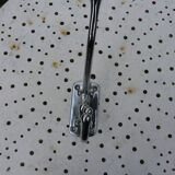 Wall-mounted coat rack in chromed metal with 4 adjustable hooks