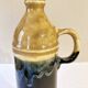 Enameled ceramic bottle with handle