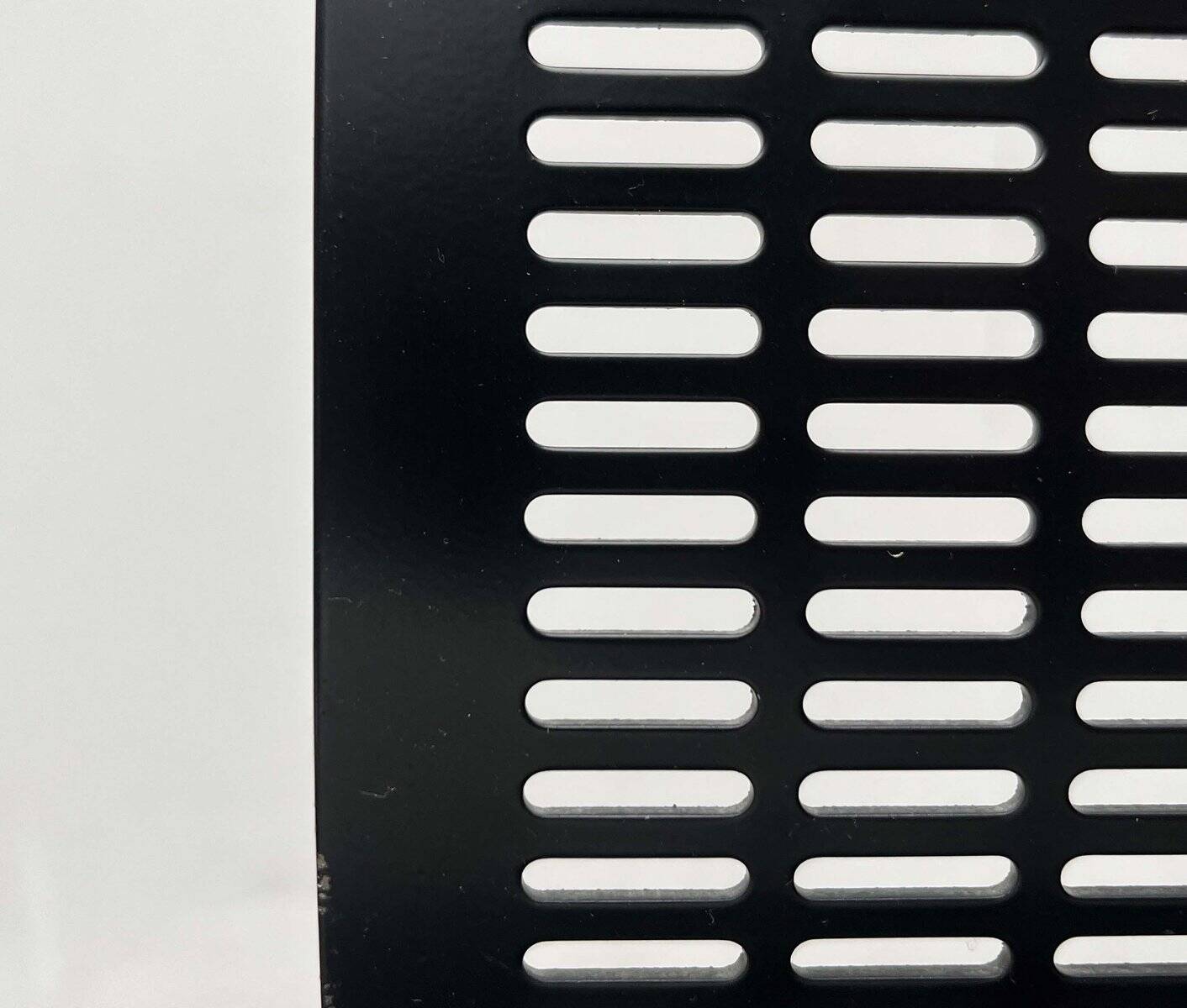 Postmodern black Quinta chair in perforated metal by Mario Botta for Alias, 1980s.