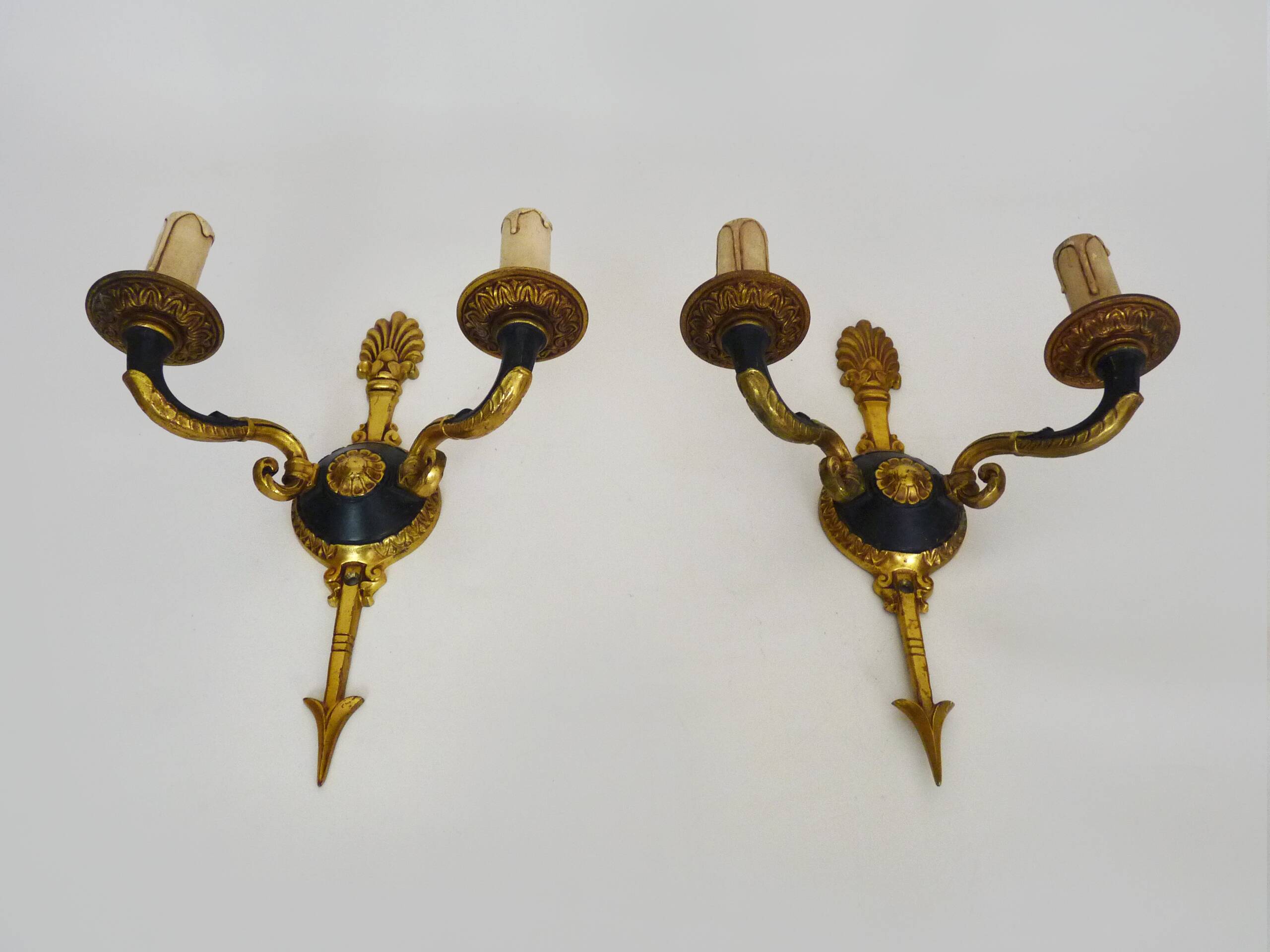Pair of wall sconces in the Empire style with double lights in bronze.
