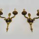 Pair of wall sconces in the Empire style with double lights in bronze.