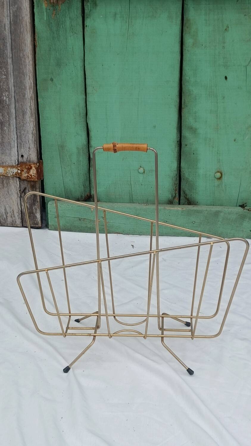 Vintage magazine rack in golden brass