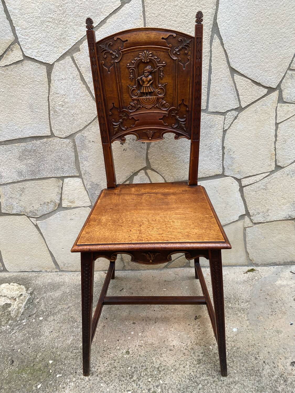 Carved walnut lounge chair
