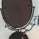 Table mirror, tilting psyche in patinated bronze decorated with leaves and fruits