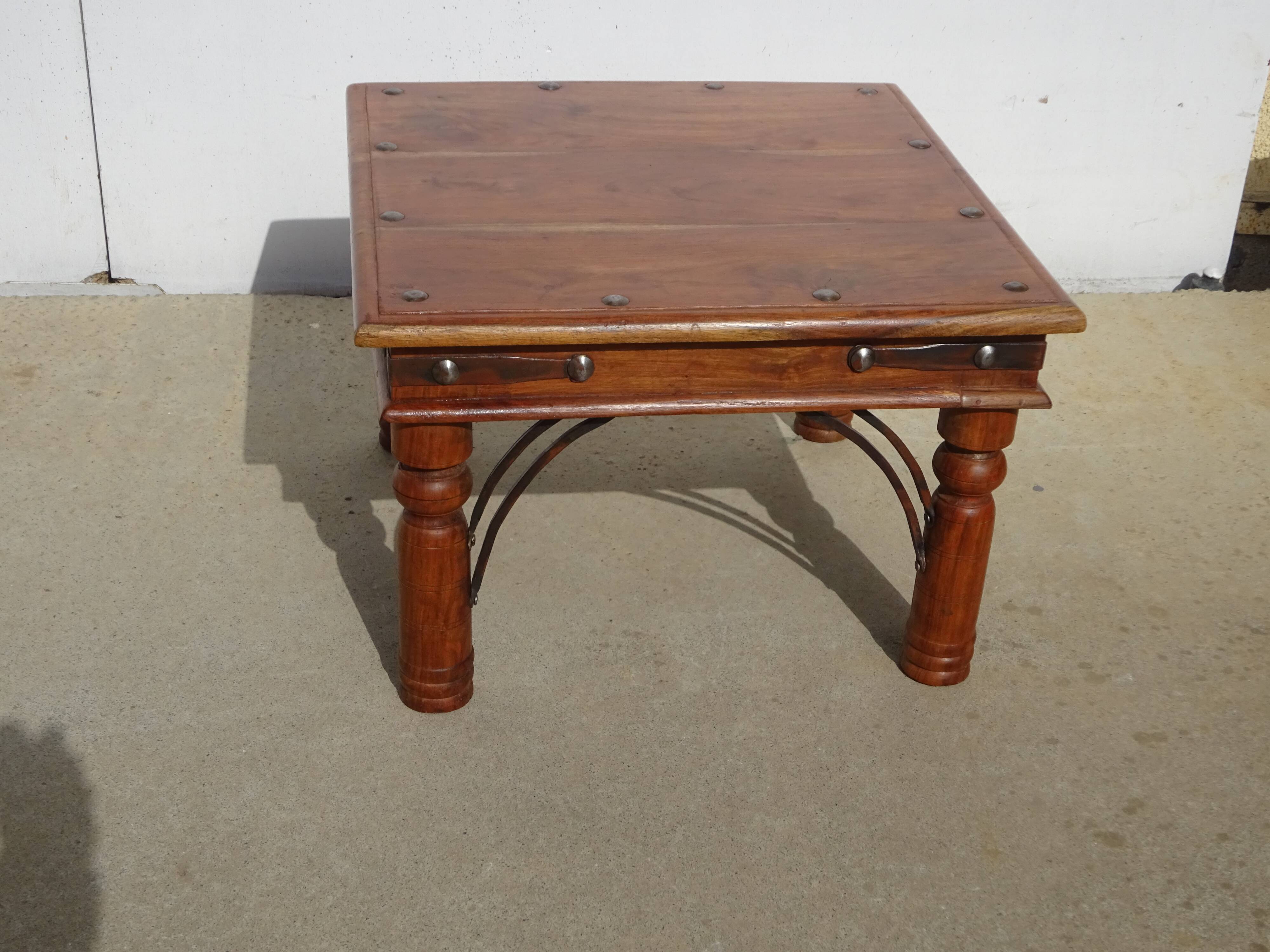 Square coffee table in exotic wood and wrought iron.