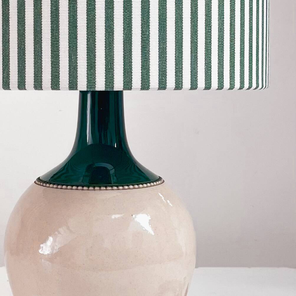 Sandstone lamp and striped lampshade
