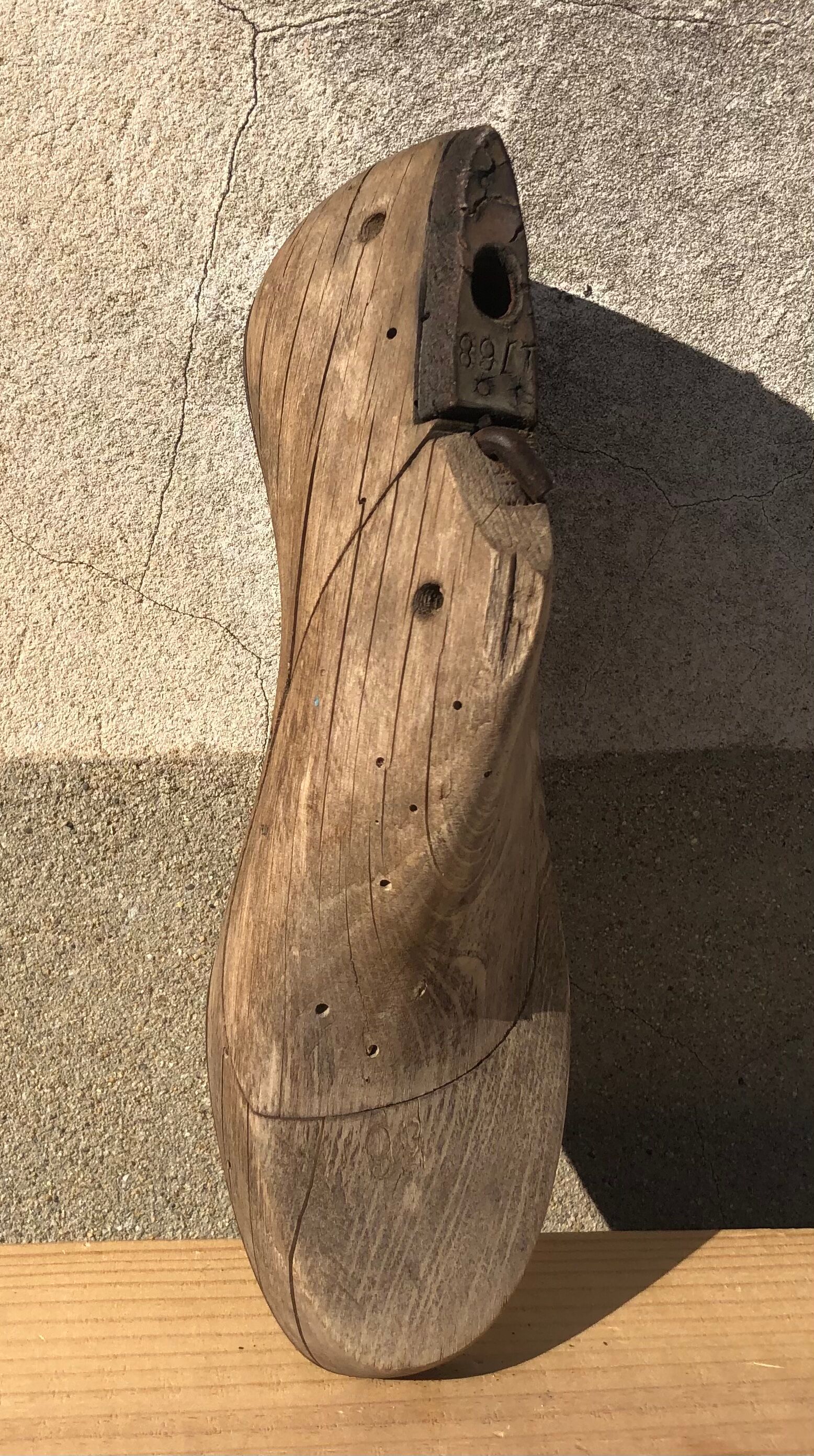 Old wooden and metal shoe tree