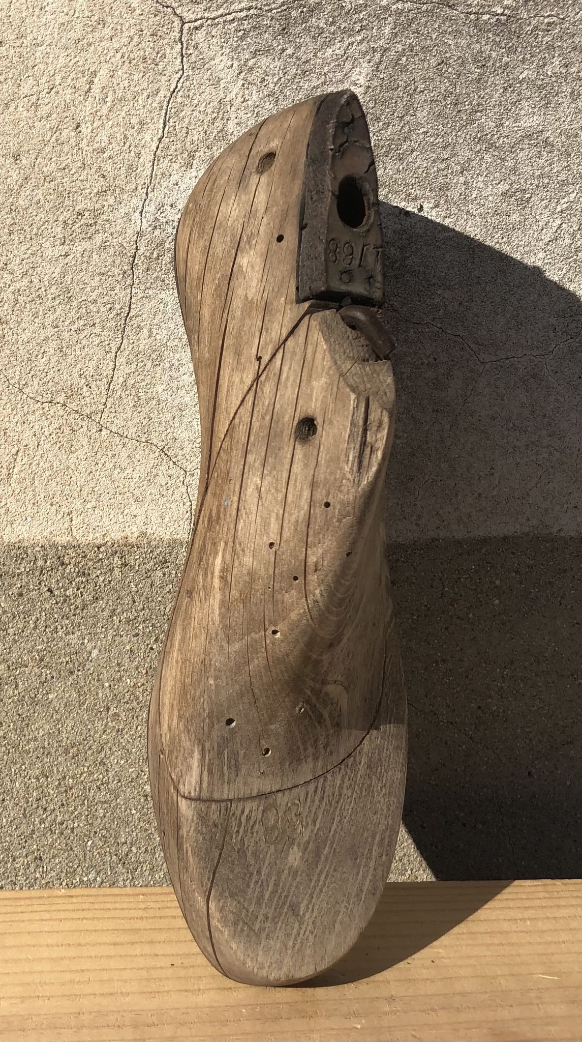 Old wooden and metal shoe tree