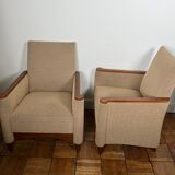 Pair of armchairs in carved wood and vintage fabric