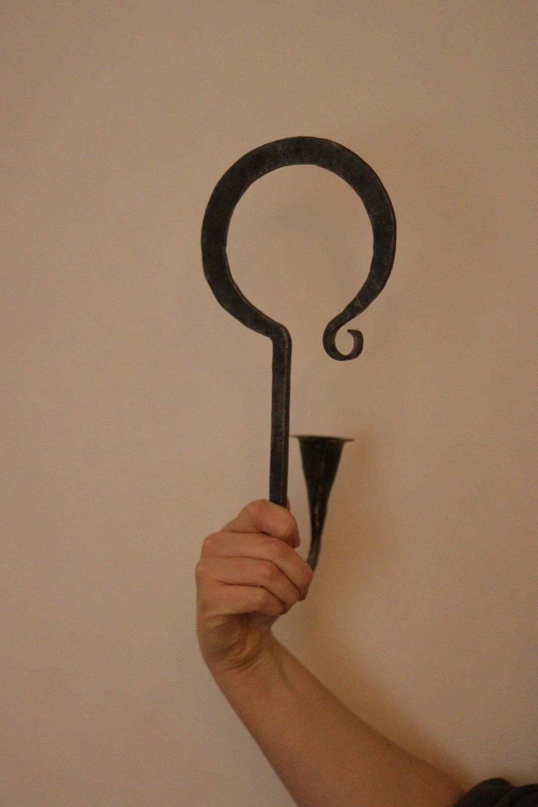Pair of Swedish wall sconces in wrought iron, mid-20th century style, signed Akta.