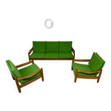 Living room sofa and Scandinavian design armchairs from the 1960s in green boucle.