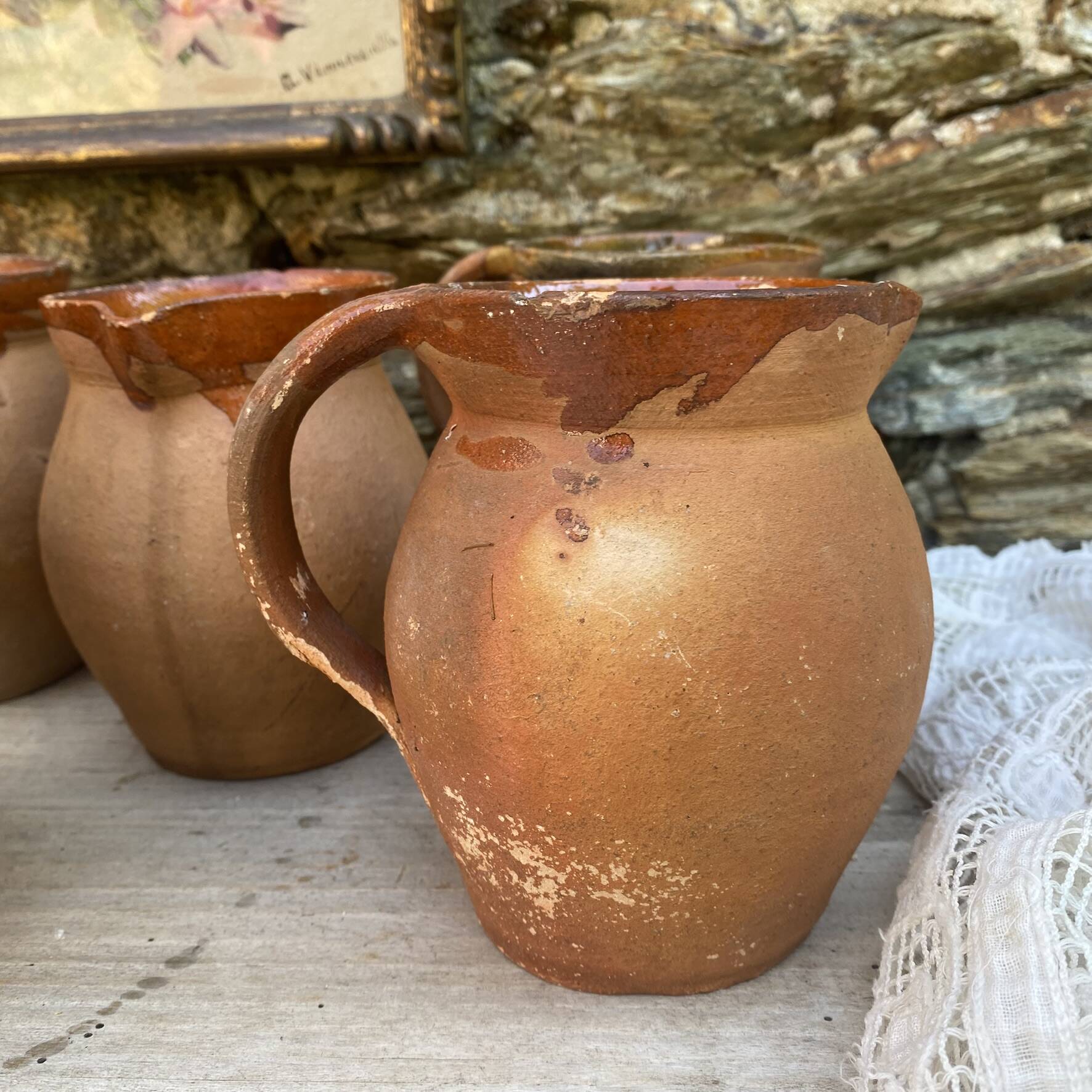set of terracotta jugs country style