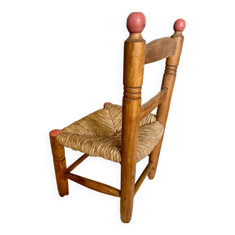 Vintage, rustic children's chair, old wooden and straw chair