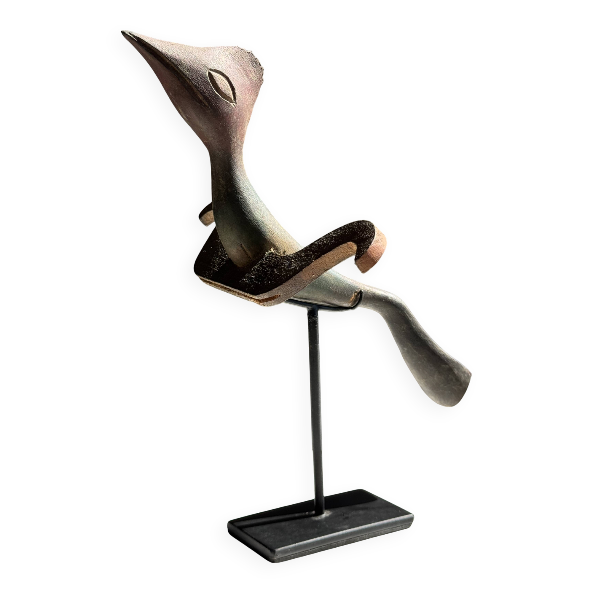 Traditional Indonesian decorative wooden bird on a base, crest model.