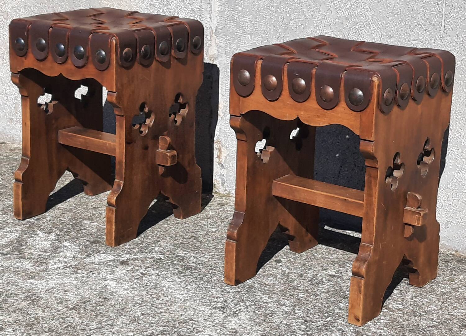 Pair of brutalist stools, leather seat.