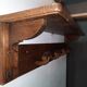 Wearing a brutalist style wooden wall coat