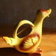 Ceramic watering can in white earthenware, yellow enamel and bird shape