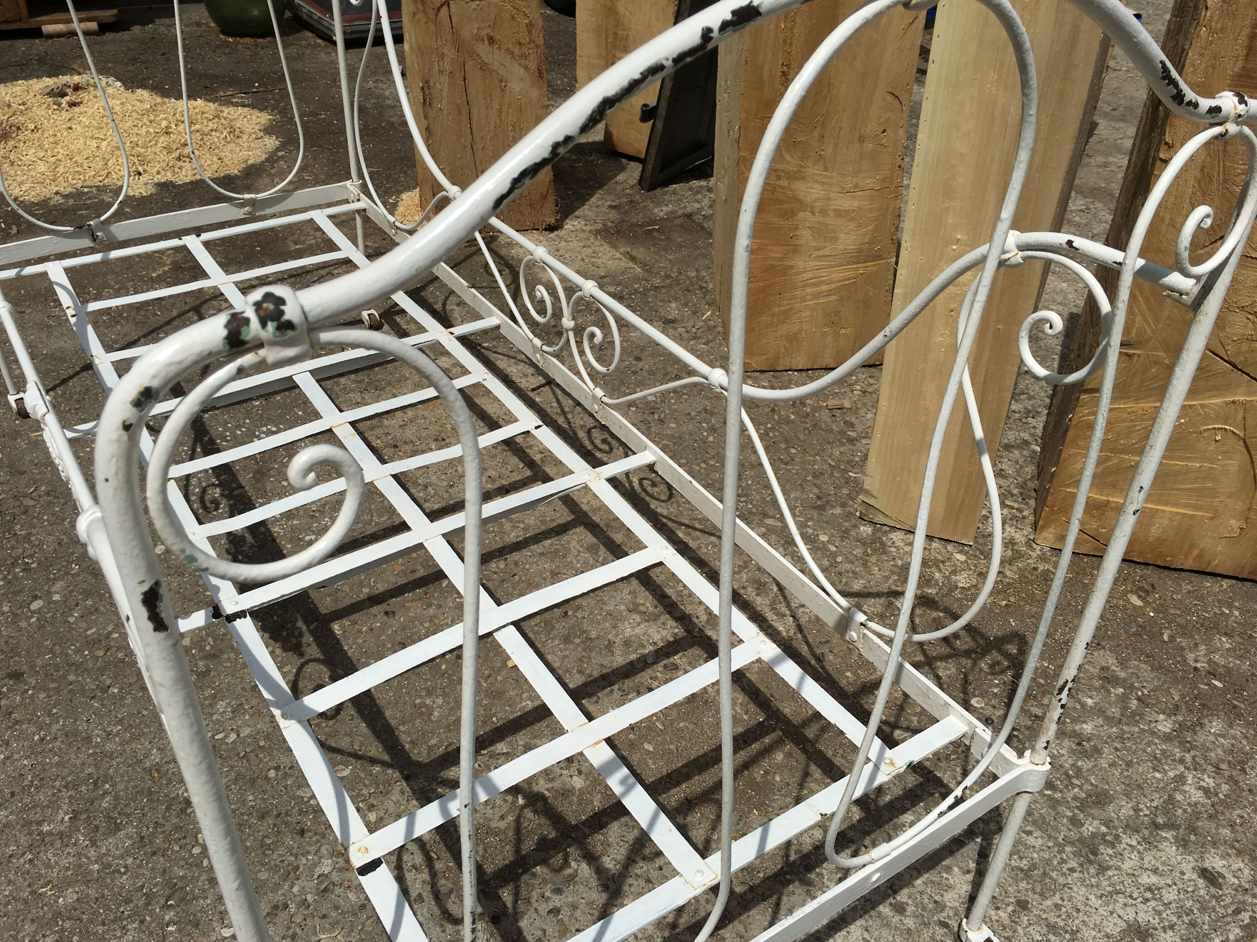 Ancient white metal bed