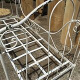 Ancient white metal bed