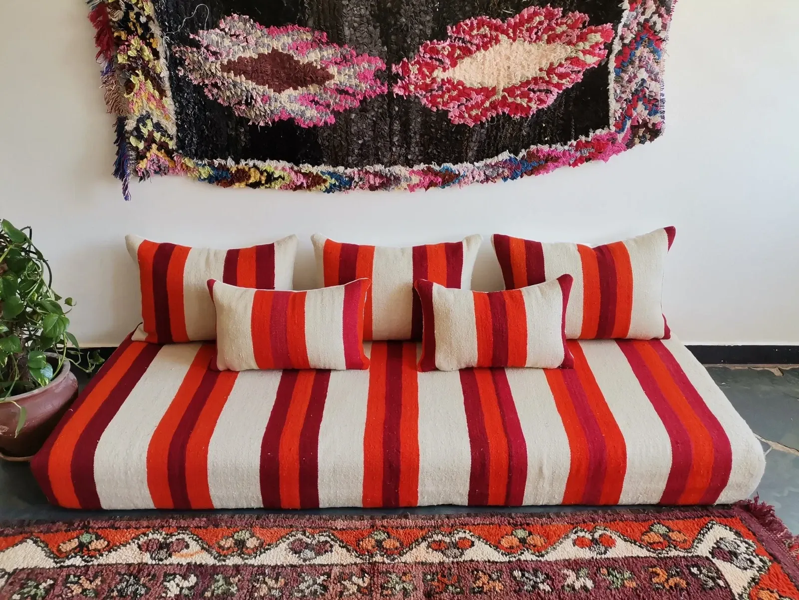 Set of covers for cream and red Moroccan floor sofa.