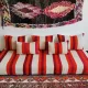 Set of covers for cream and red Moroccan floor sofa.