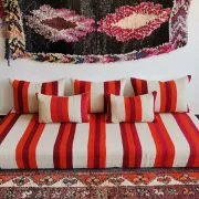 Set of covers for cream and red Moroccan floor sofa.