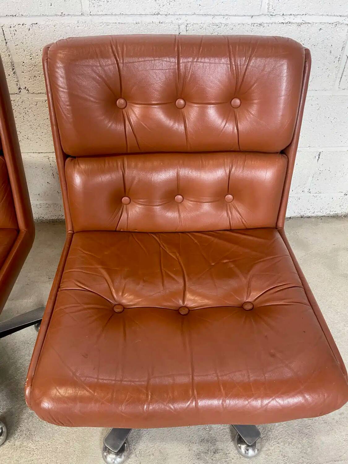 Pair of brown leather armchairs 1980