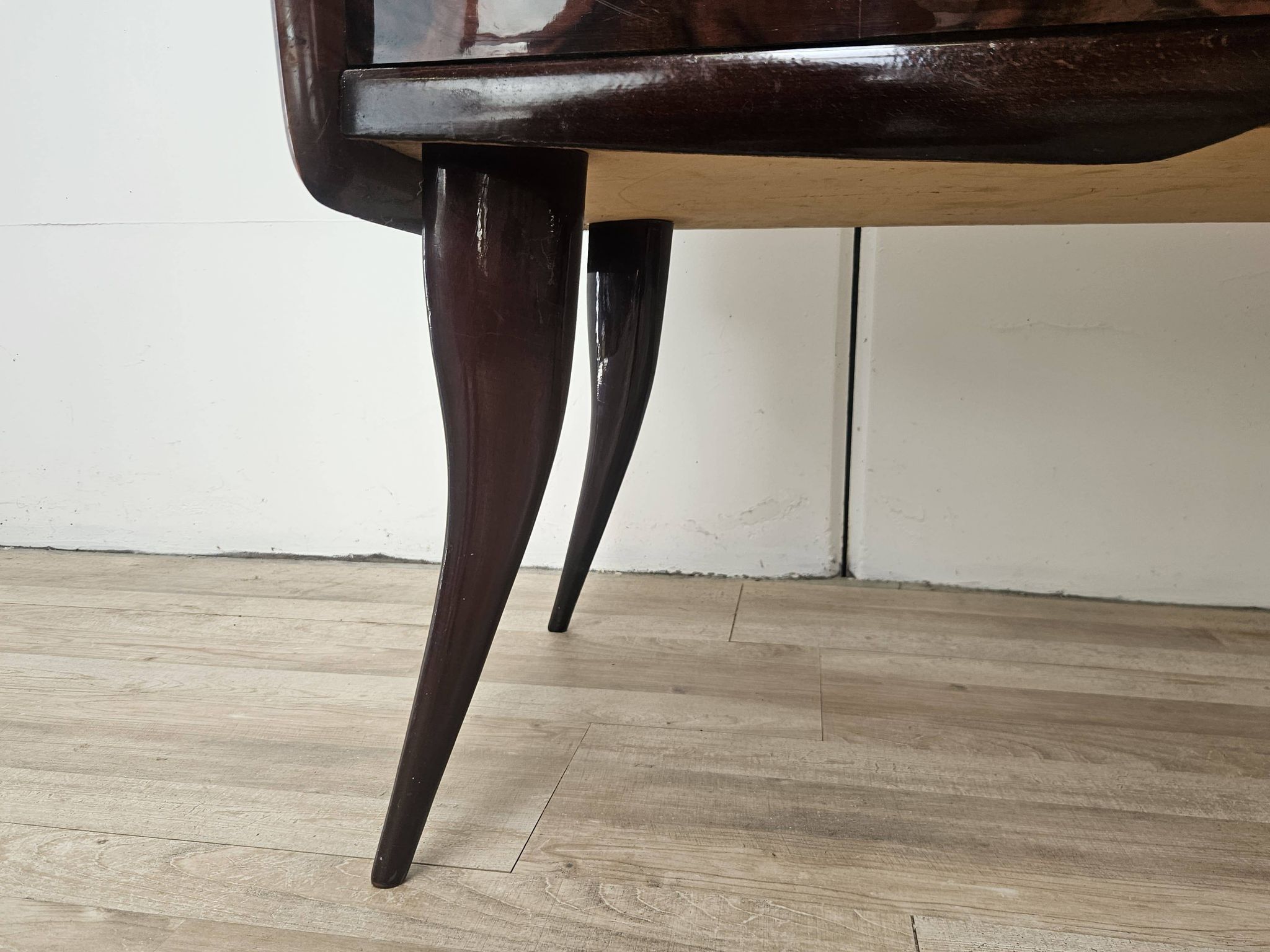 Mid-century mahogany buffet with teal glass and compartments with a drawer.