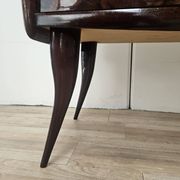 Mid-century mahogany buffet with teal glass and compartments with a drawer.