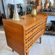 Vintage wooden and rattan chest of drawers with tapered legs.