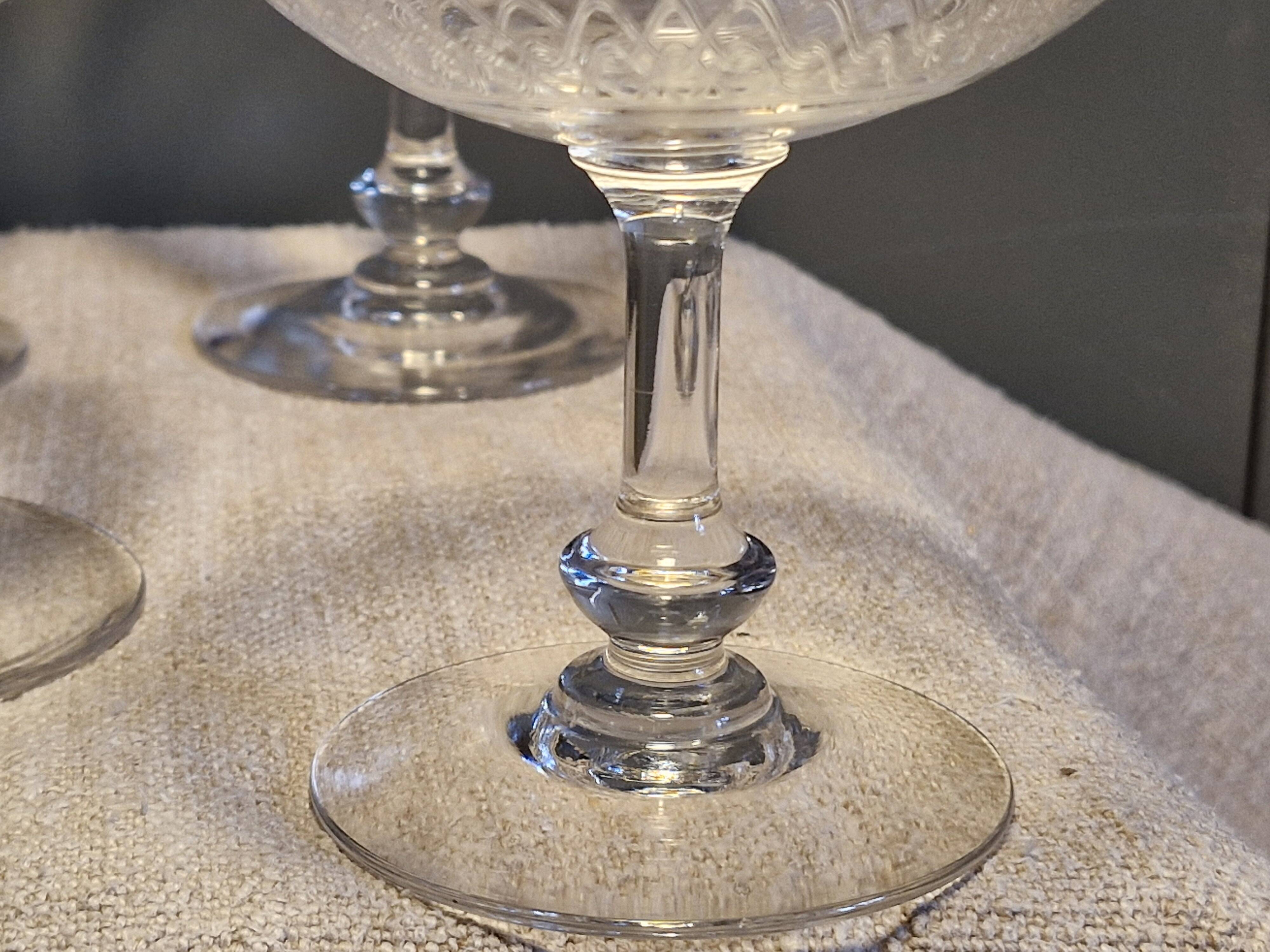 8 antique Baccarat crystal champagne coupes with engraved decoration.