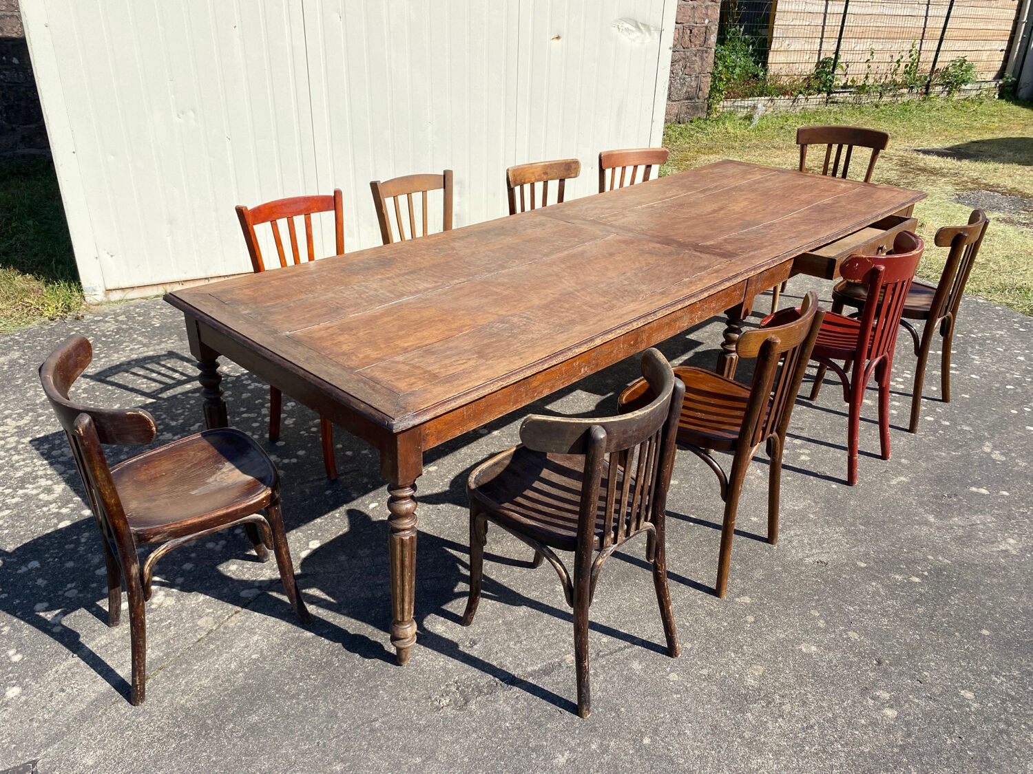 Draper table and its 10 chairs