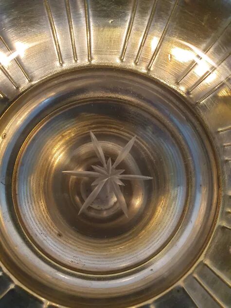 Art Deco brass cup and its engraved saucer.