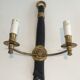Pair of Black Lacquered Bronze Wall Lamps with Lions' Head Decorations. Around 1970