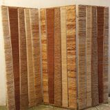 Straw and woven rope screen with metal structure