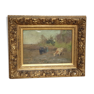 Farmer and cows in the meadow