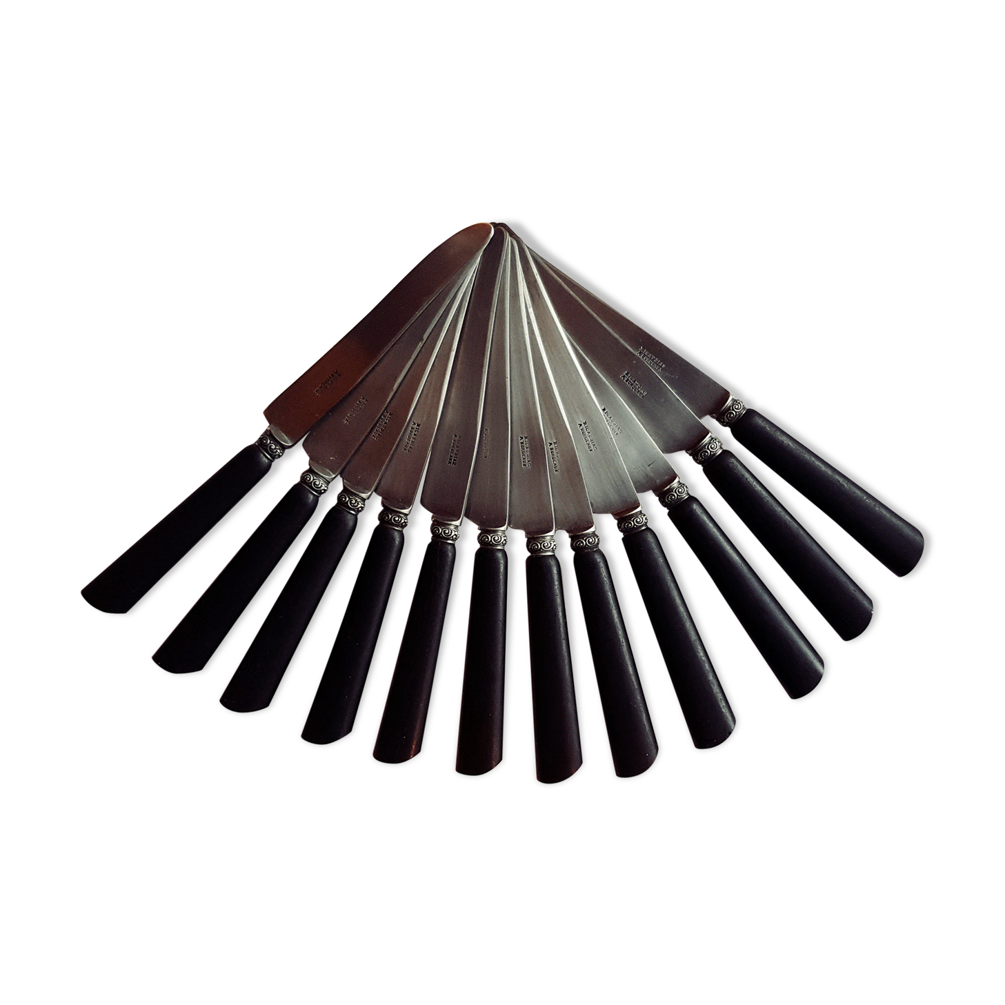 Twelve blackened wooden handle knives