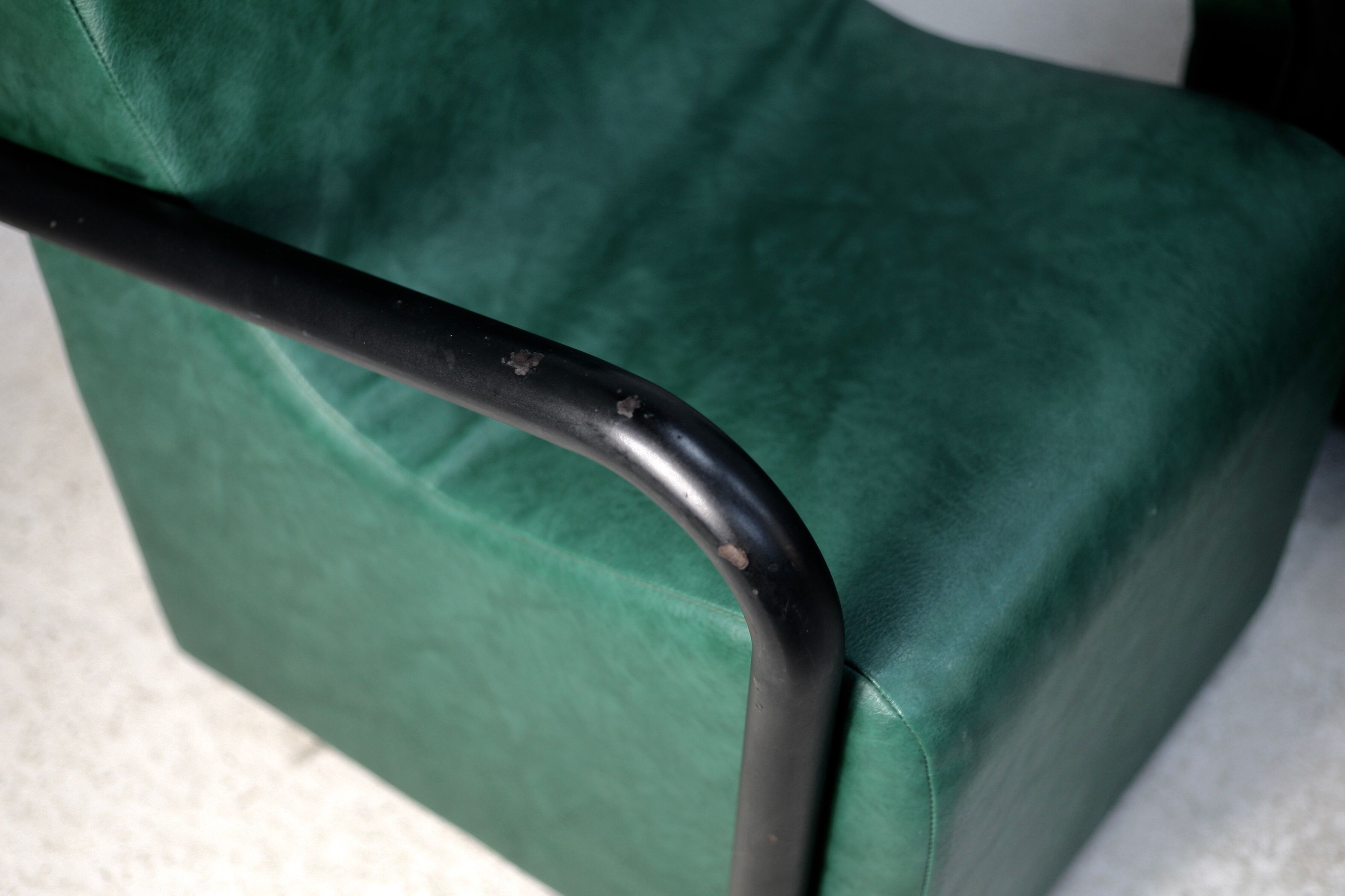 Pair of armrest heaters. Steel and green imitation leather. France, circa 1980